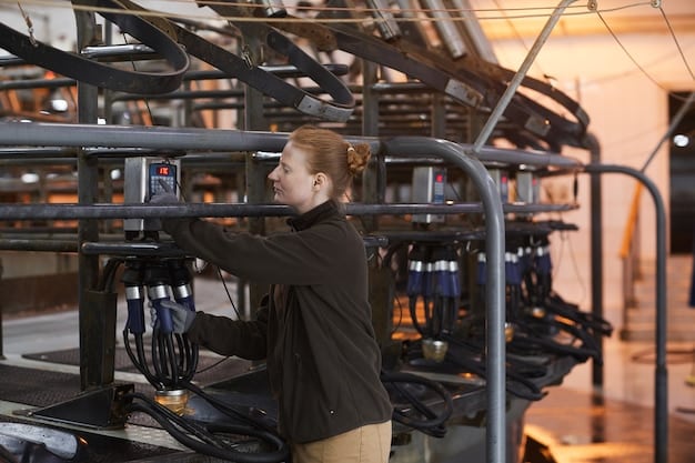 A modern factory floor with advanced machinery, showcasing automated processes and workers in clean, organized environment. Digital displays show real-time environmental data, like carbon emissions and energy consumption.