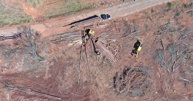 An aerial view of a dilapidated bridge undergoing repairs, emphasizing the urgency of infrastructure improvements and the potential for job creation in the construction sector.