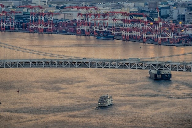 A photo of a bustling port with cargo ships loading and unloading containers between US and China, visually representing trade activities.
