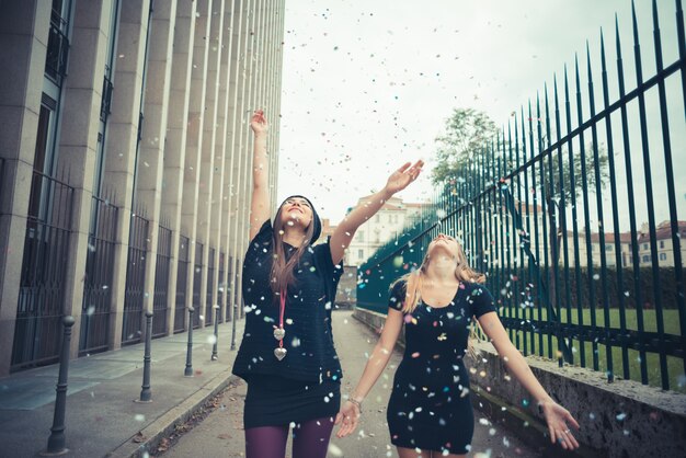 People celebrating with confetti falling, representing the joy and relief of having their student loans forgiven.