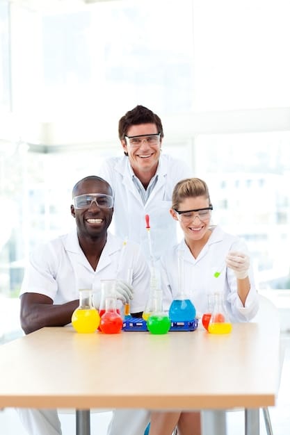 A student working in a modern chemistry lab, surrounded by beakers, test tubes, and scientific equipment, wearing safety goggles and a lab coat.