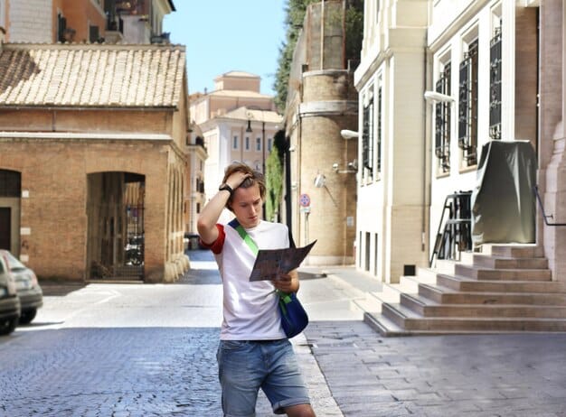 A student exploring a historic city abroad, with a backpack and a map, looking curious and excited.