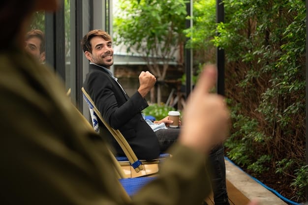 Two professionals engaged in deep conversation at an industry event, gesturing while maintaining eye contact. The surrounding environment is blurred to focus on their interaction.