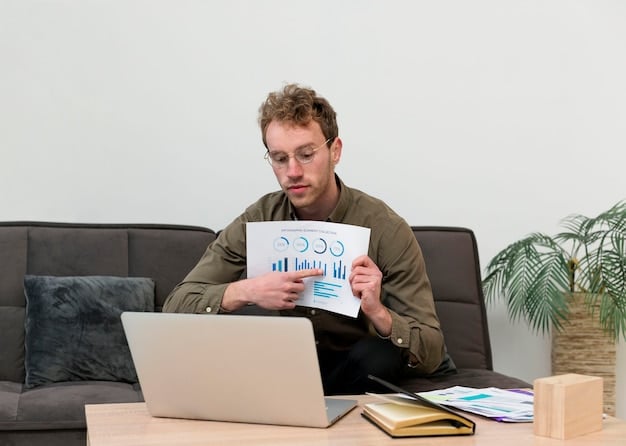 A person reviewing a budget on a laptop with charts indicating savings and expense analysis.
