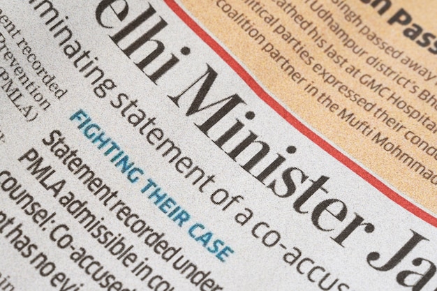 A close-up image of a newspaper headline highlighting 