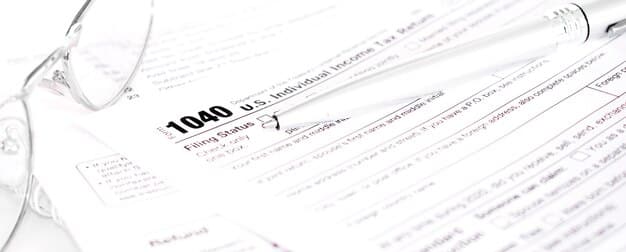 A close-up of an IRS Publication 590-B document, specifically highlighting the section with the life expectancy table used for calculating RMDs. Next to it is a calculator and a pen pointing to a particular age and its corresponding life expectancy factor.