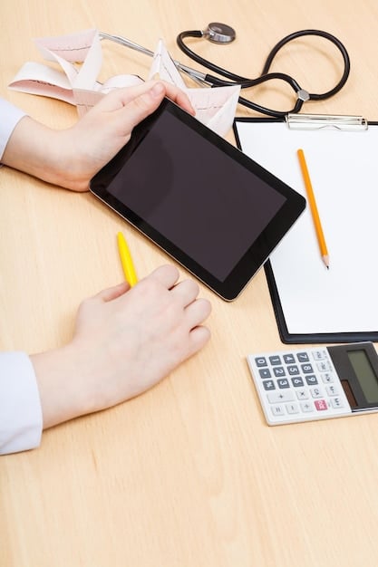 A close-up of a person's hands using a calculator and reviewing medical bills while planning their HSA contributions and healthcare expenses.