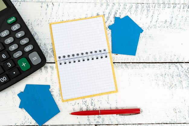 A close-up of a Housing Choice Voucher form, highlighted with a pen, lying on a desk with financial documents and a calculator.