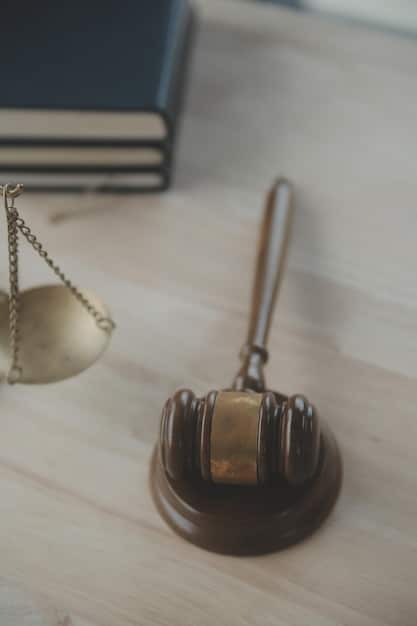 A close-up image of a gavel hitting a sounding block, with a soft focus background of law books, symbolizing legal assistance and justice.