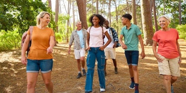 A diverse group of people participating in a guided nature walk, emphasizing social interaction, community, and the shared benefits of outdoor experiences.