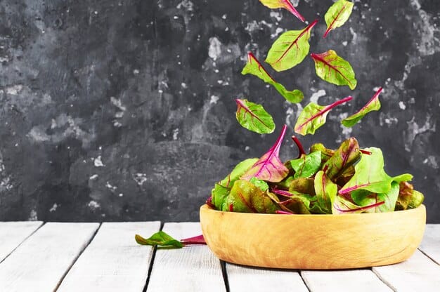A vibrant salad bowl filled with a variety of leafy greens such as spinach, kale, and romaine lettuce, mixed with other colorful vegetables and a light vinaigrette. The image highlights the nutritional benefits of leafy greens for mental health.