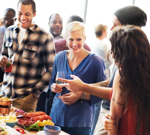 A group of people at a fundraising event, showing community support and engagement.