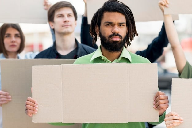 A group of people of different ages and backgrounds participating in a peaceful protest, holding signs and banners advocating for social change.