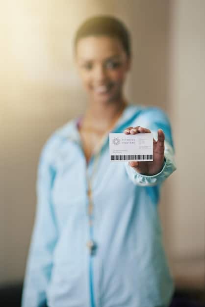 A close-up shot of a health insurance card with the ACA logo faintly visible in the background. The focus is on the details of the card and the subtle reference to the Affordable Care Act.